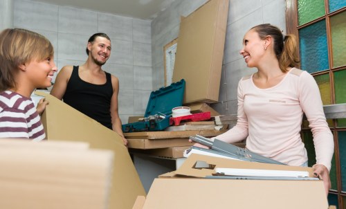 Moving truck and packed boxes prepared for a Kensington home relocation
