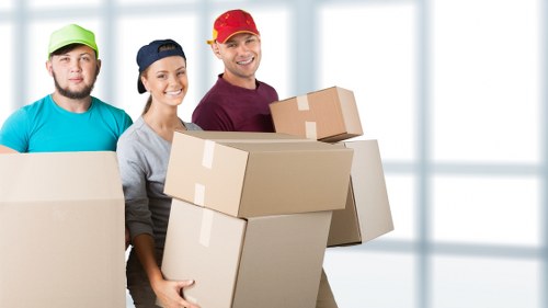 A removal van and moving equipment arranged for a Kensington property