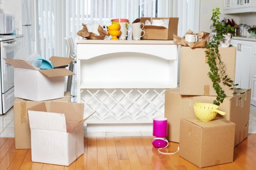 Packing boxes and small furniture for a student move in Kensington