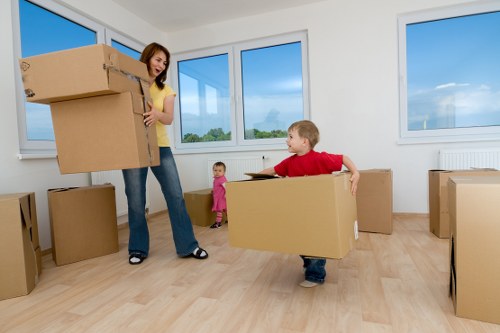 Loading boxes and furniture into a van for a Kensington collection