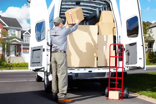 Packed moving boxes and protective wrapping for Kensington removals