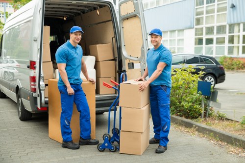 Professional movers assisting with a planned house or office relocation