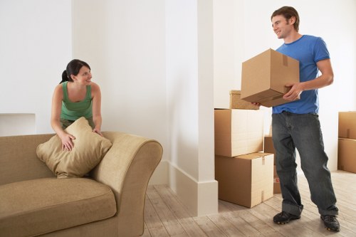 Furniture being carried down stairs in a Kensington property move